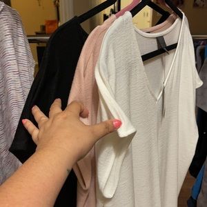 3 pack of tops.  2 with tags, 1 worn once